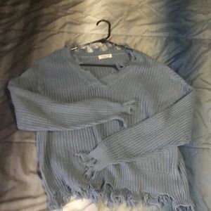 Cute blue sweater with a bit of fringe